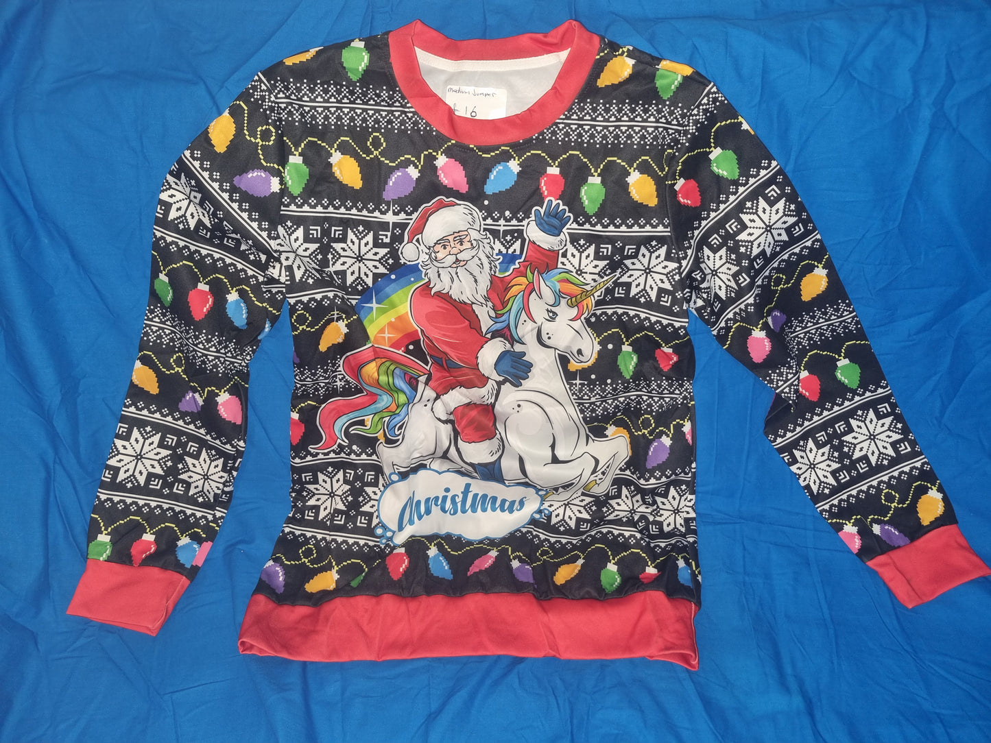 WOMENS SANTA RIDING A UNICORN JUMPER