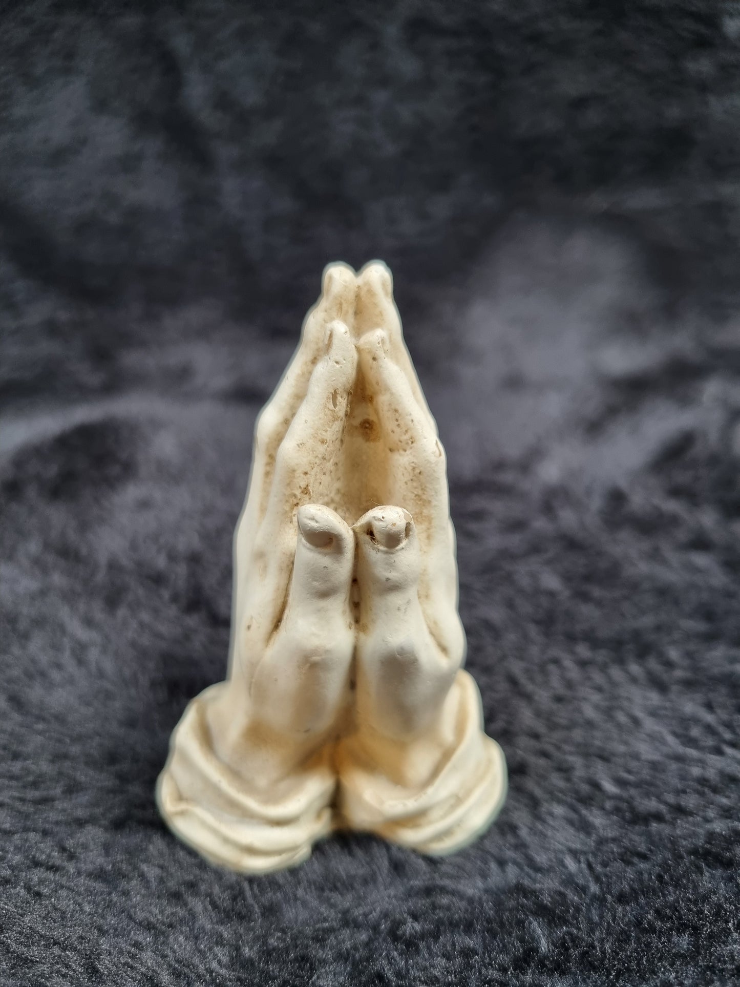 Pray hands statue