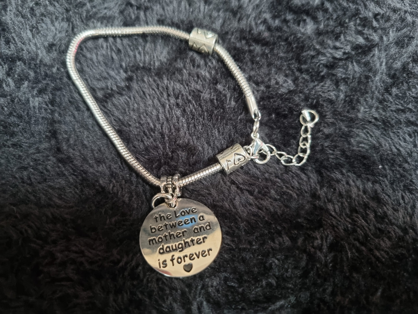 The love between a mother and daughter... charm bracelet