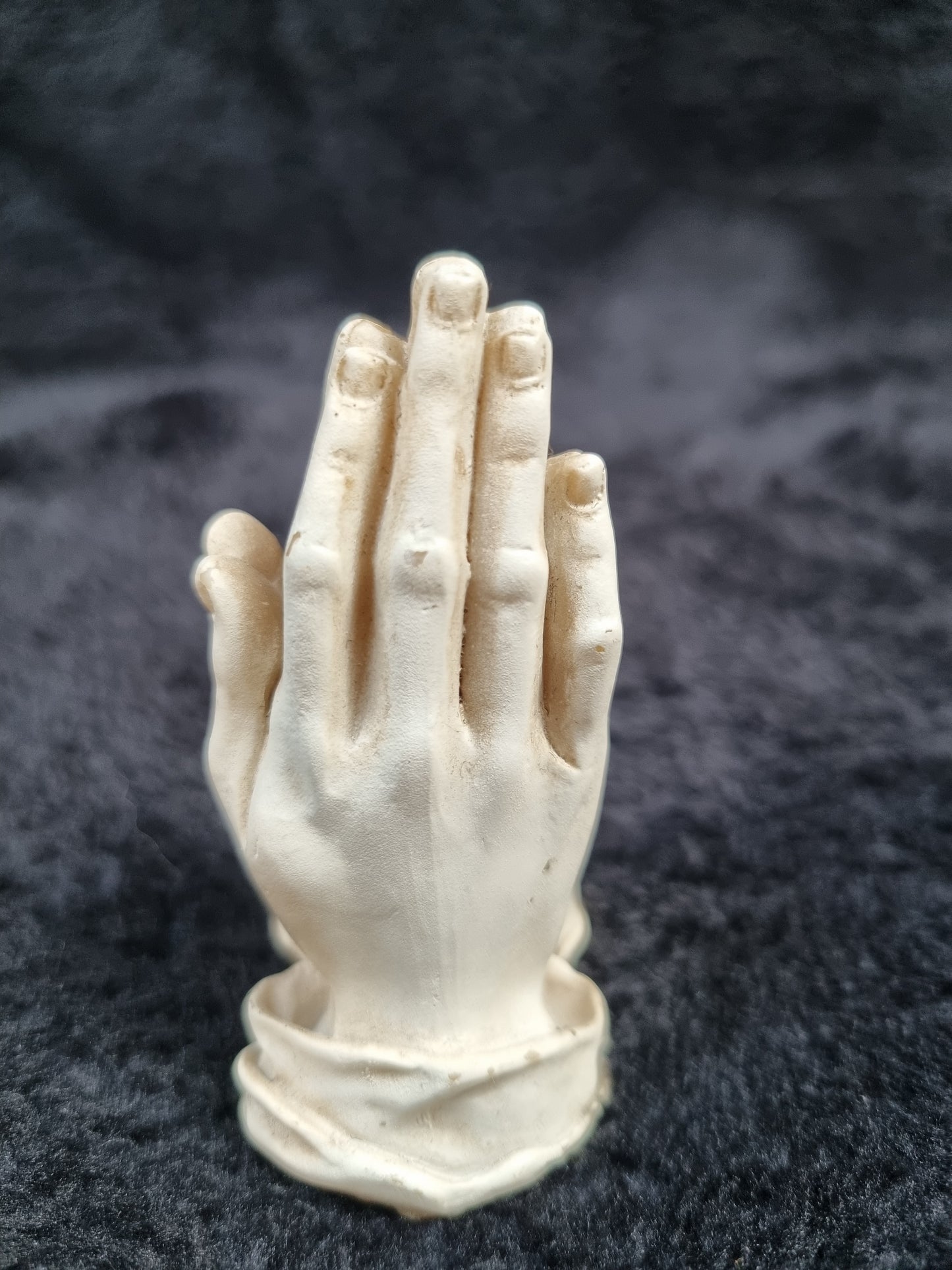 Pray hands statue