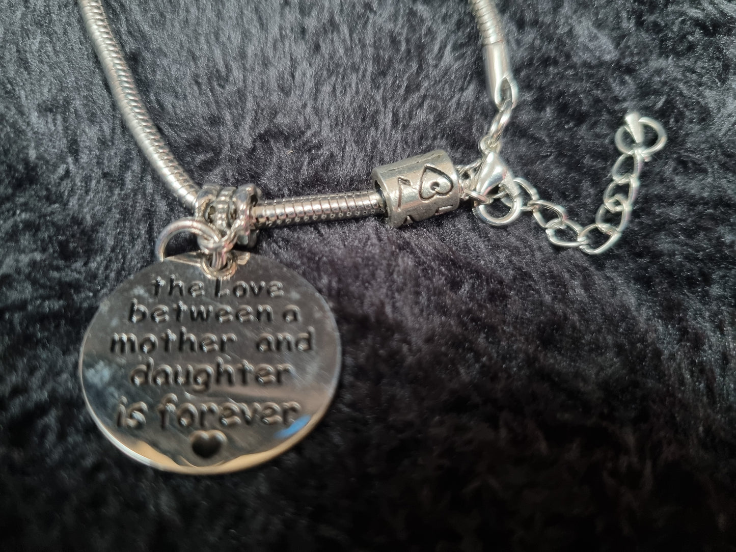 The love between a mother and daughter... charm bracelet