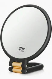 MAGNIFYING HANDHELD MIRROR