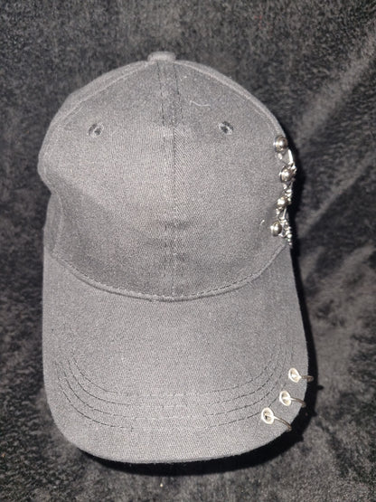 Black childrens baseball cap with metal rings